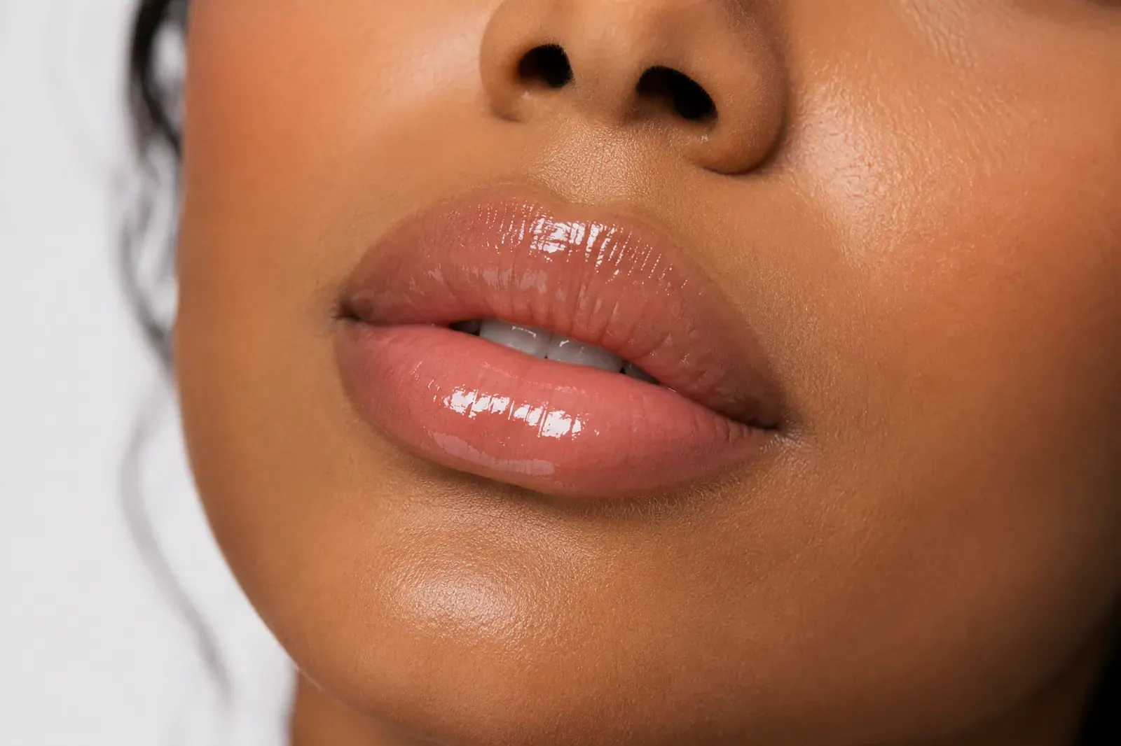 Close-up of naturally plump, hydrated lips showcasing lip enhancement results at Englewood Med Spa.
